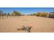 Horse arena features a well-maintained sandy surface with equipment, offering a professional training space at 35844 N 12Th St, Phoenix, AZ 85086