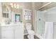 Bathroom featuring a white vanity, toilet, and shower at 36070 N Quiros Dr, San Tan Valley, AZ 85143
