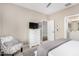 Bright bedroom featuring carpet, neutral walls, ceiling fan, and ensuite bathroom at 36070 N Quiros Dr, San Tan Valley, AZ 85143