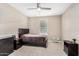 Bedroom featuring neutral walls, carpet, window and ceiling fan at 36070 N Quiros Dr, San Tan Valley, AZ 85143