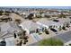 Overhead image captures several single-Gathering homes in a planned community, complete with neat landscaping and driveways at 36070 N Quiros Dr, San Tan Valley, AZ 85143