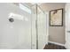 Modern shower featuring glass enclosure, tile surround, and sleek fixtures at 36070 N Quiros Dr, San Tan Valley, AZ 85143