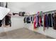 Walk-in closet providing ample storage space for clothing, shoes, and accessories at 36070 N Quiros Dr, San Tan Valley, AZ 85143