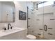 This modern bathroom features white tiling, glass shower, and a vanity with storage at 37200 N Cave Creek Rd # 1035, Scottsdale, AZ 85262