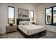 Bedroom with a serene desert view, neutral tones, and an artistic aesthetic at 37200 N Cave Creek Rd # 1035, Scottsdale, AZ 85262