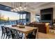 Inviting dining area flows into the living room with views of the outdoor pool and desert landscape at 37200 N Cave Creek Rd # 1035, Scottsdale, AZ 85262
