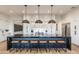 Modern kitchen with a large island, stylish pendant lights, and sleek cabinetry at 37200 N Cave Creek Rd # 1035, Scottsdale, AZ 85262