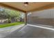 Spacious covered back patio with ceiling fan and artificial grass at 3777 E Latham Ct, Gilbert, AZ 85297