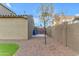 Low maintenance backyard with gravel and artificial turf, enclosed by a brick wall at 3777 E Latham Ct, Gilbert, AZ 85297