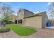 The backyard has artificial turf, gravel, and a partial view of the two-story home at 3777 E Latham Ct, Gilbert, AZ 85297