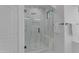 Modern bathroom featuring a glass-enclosed shower with a built-in bench and tiled walls at 3777 E Latham Ct, Gilbert, AZ 85297