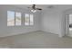 Spacious, sunlit bedroom with plantation shutters and neutral carpeting at 3777 E Latham Ct, Gilbert, AZ 85297