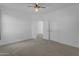 Neutrally decorated bedroom with carpet, white walls, an entry and closet with modern doors at 3777 E Latham Ct, Gilbert, AZ 85297