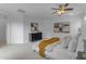 Spacious bedroom featuring soft carpet, modern decor, a ceiling fan, and shutters on the windows at 3777 E Latham Ct, Gilbert, AZ 85297