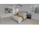 Bright bedroom featuring a ceiling fan, shutters on the window, and neutral decor for a relaxing ambiance at 3777 E Latham Ct, Gilbert, AZ 85297