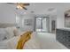 Well-lit bedroom featuring soft carpet, modern decor, and a sliding glass door for indoor-outdoor living at 3777 E Latham Ct, Gilbert, AZ 85297