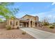 Beautiful two-story home with desert landscaping, a covered driveway, and a well-maintained front yard at 3777 E Latham Ct, Gilbert, AZ 85297