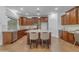 Spacious kitchen featuring a granite island, pendant lighting, and tile flooring at 3777 E Latham Ct, Gilbert, AZ 85297