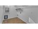 Bright laundry room featuring built-in shelves and tiled flooring at 3777 E Latham Ct, Gilbert, AZ 85297