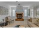 Living room features a cozy fireplace and calming neutral hues at 3777 E Latham Ct, Gilbert, AZ 85297