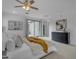 Bright main bedroom with light-colored walls, carpet, a sliding glass door and a view to the back yard at 3777 E Latham Ct, Gilbert, AZ 85297
