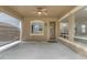 Covered patio with ceiling fan, exterior windows, and a screened enclosure at 3777 E Latham Ct, Gilbert, AZ 85297