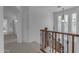 Staircase landing with a view of the hallway and windows at 3777 E Latham Ct, Gilbert, AZ 85297