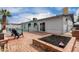 Backyard showing patio, outdoor seating, and a private pool with a secure fence at 3832 W Eva St, Phoenix, AZ 85051
