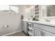 Modern bathroom featuring double sinks, quartz counters, and stylish fixtures at 3832 W Eva St, Phoenix, AZ 85051
