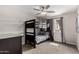 ' bedroom showcases a bunk bed with a window and ceiling fan at 3832 W Eva St, Phoenix, AZ 85051