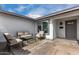 Comfortable front porch sitting area with rug and furniture at 3832 W Eva St, Phoenix, AZ 85051