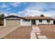 Charming single-story home with a well-maintained front yard and attached garage at 3832 W Eva St, Phoenix, AZ 85051