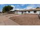 Beautiful single-story home with desert landscaping, walkway and attached garage at 3832 W Eva St, Phoenix, AZ 85051