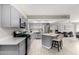Contemporary kitchen with stainless appliances, island with seating and plenty of storage at 3832 W Eva St, Phoenix, AZ 85051