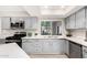 Well-lit kitchen with updated countertops, modern appliances, and ample cabinet space at 3832 W Eva St, Phoenix, AZ 85051