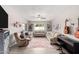 Inviting living room with comfortable furniture, tile flooring, and bright windows at 3832 W Eva St, Phoenix, AZ 85051