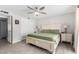 Comfortable main bedroom with a ceiling fan and neutral tones at 3832 W Eva St, Phoenix, AZ 85051