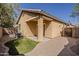 Exterior view of the home's backyard with covered patio and landscaped features at 3894 E Palmer St, Gilbert, AZ 85298