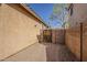 Rear yard featuring neutral stucco exterior and brick paved walkway at 3894 E Palmer St, Gilbert, AZ 85298