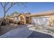 Charming single-story home featuring a tile roof, two-car garage, and manicured landscaping at 3894 E Palmer St, Gilbert, AZ 85298