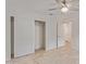 Bedroom featuring neutral colors, tile flooring, ceiling fan and closet with sliding doors at 3947 E Constitution Dr, Gilbert, AZ 85296