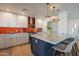 Well-lit kitchen with granite counters, stainless steel appliances, and ample cabinet space at 406 W Flower St, Phoenix, AZ 85013