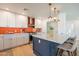Well-lit kitchen with granite counters, stainless steel appliances, and ample cabinet space at 406 W Flower St, Phoenix, AZ 85013