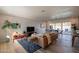 Bright living room featuring modern furniture, wood flooring, and sliding glass doors at 406 W Flower St, Phoenix, AZ 85013