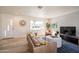 Cozy living room featuring natural light, modern furniture, and wood flooring at 406 W Flower St, Phoenix, AZ 85013