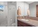 Bathroom with granite countertops, wood cabinets, and a view of the mountains at 41353 N 106Th St, Scottsdale, AZ 85262