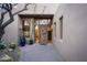 Inviting front entrance with a decorative wreath, desert landscaping, and views into the living area at 41353 N 106Th St, Scottsdale, AZ 85262