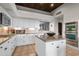 Well-lit kitchen with stainless steel appliances, custom cabinets, granite countertops, and a tile backsplash at 41353 N 106Th St, Scottsdale, AZ 85262