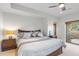 Cozy bedroom with access to a private balcony and an adjacent ensuite at 41353 N 106Th St, Scottsdale, AZ 85262