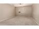 Carpeted bedroom bathed in light, featuring a ceiling fan and a large window at 4148 E Coolbrook Ave, Phoenix, AZ 85032